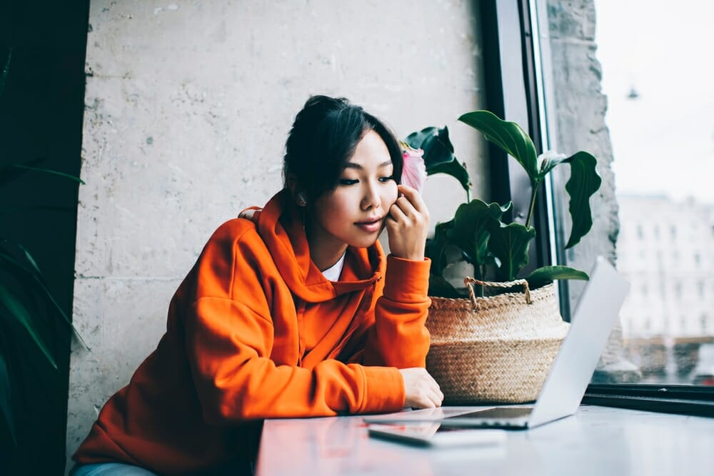 Student watching educational video on computer 