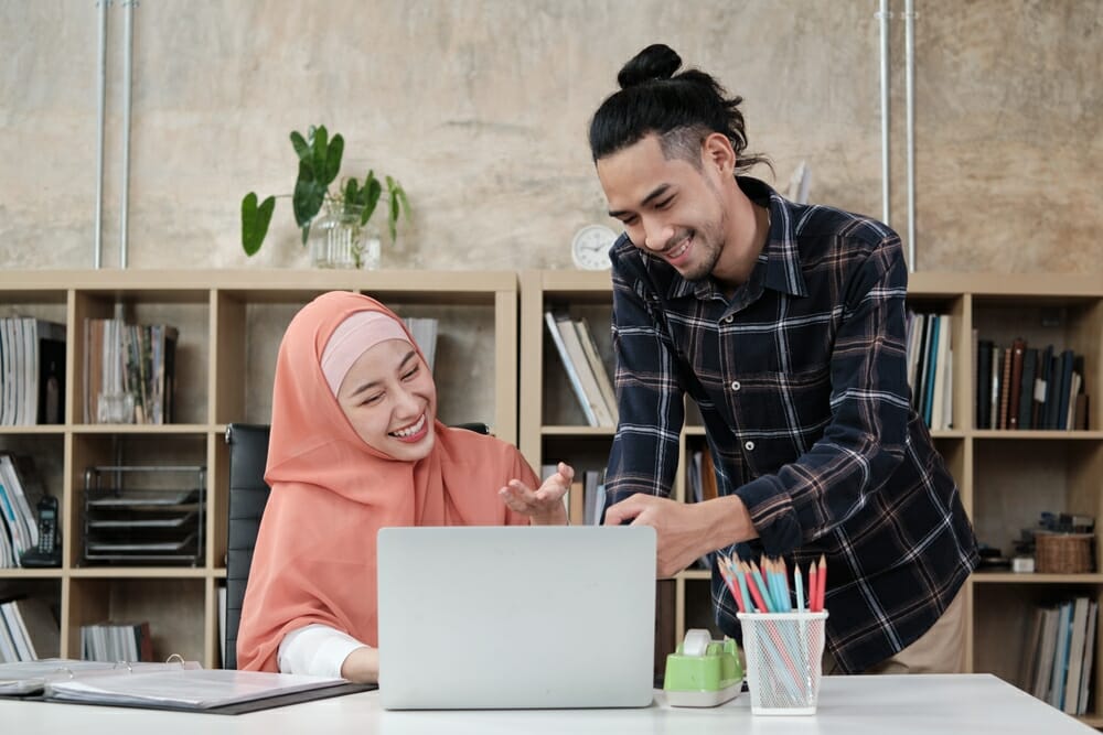 Two students collaborating at computer