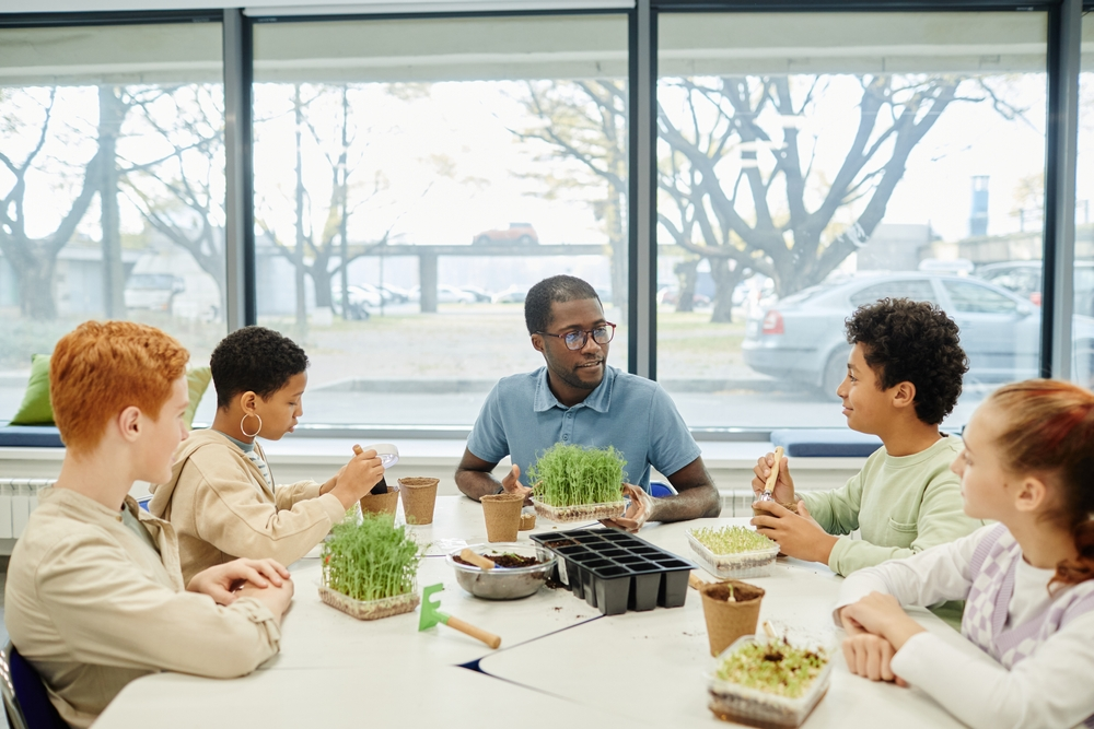 Teacher interacting with group of students