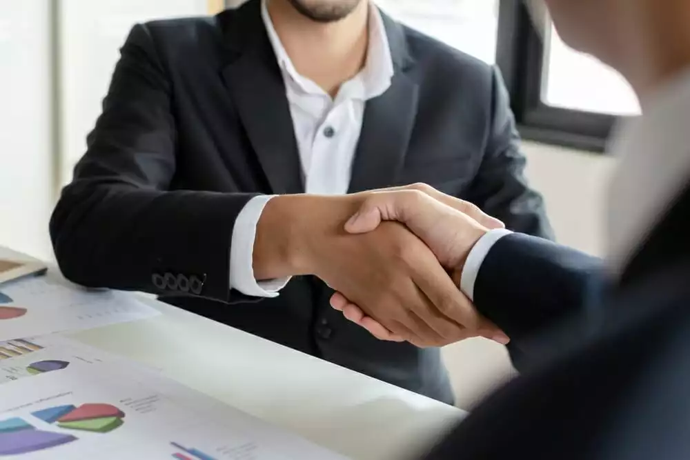 Two business partners shaking hands