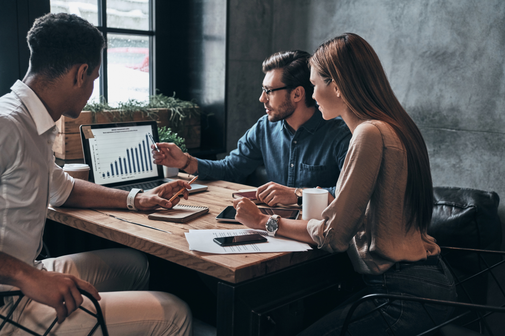 three people working on a project